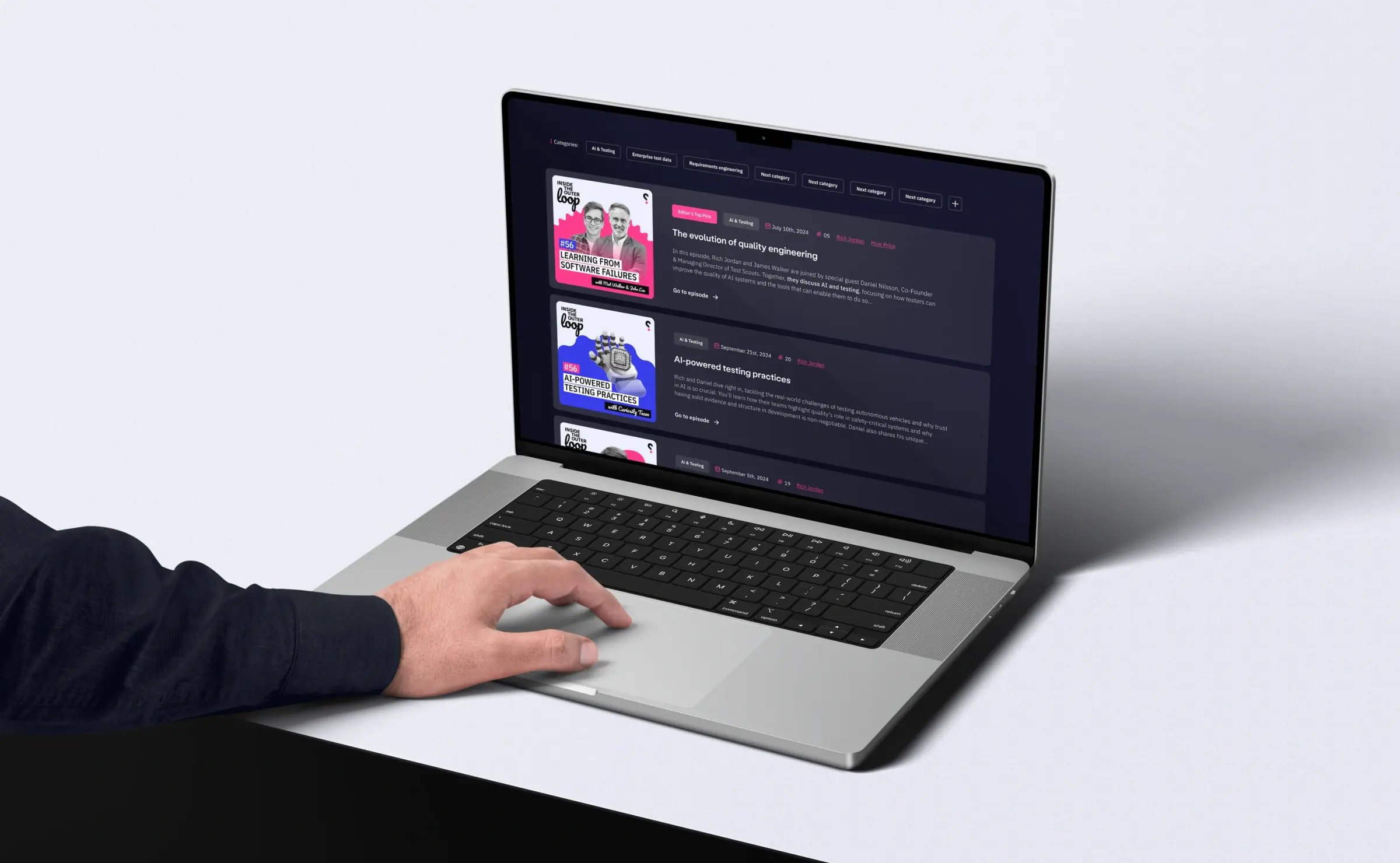 A person scrolling on a laptop