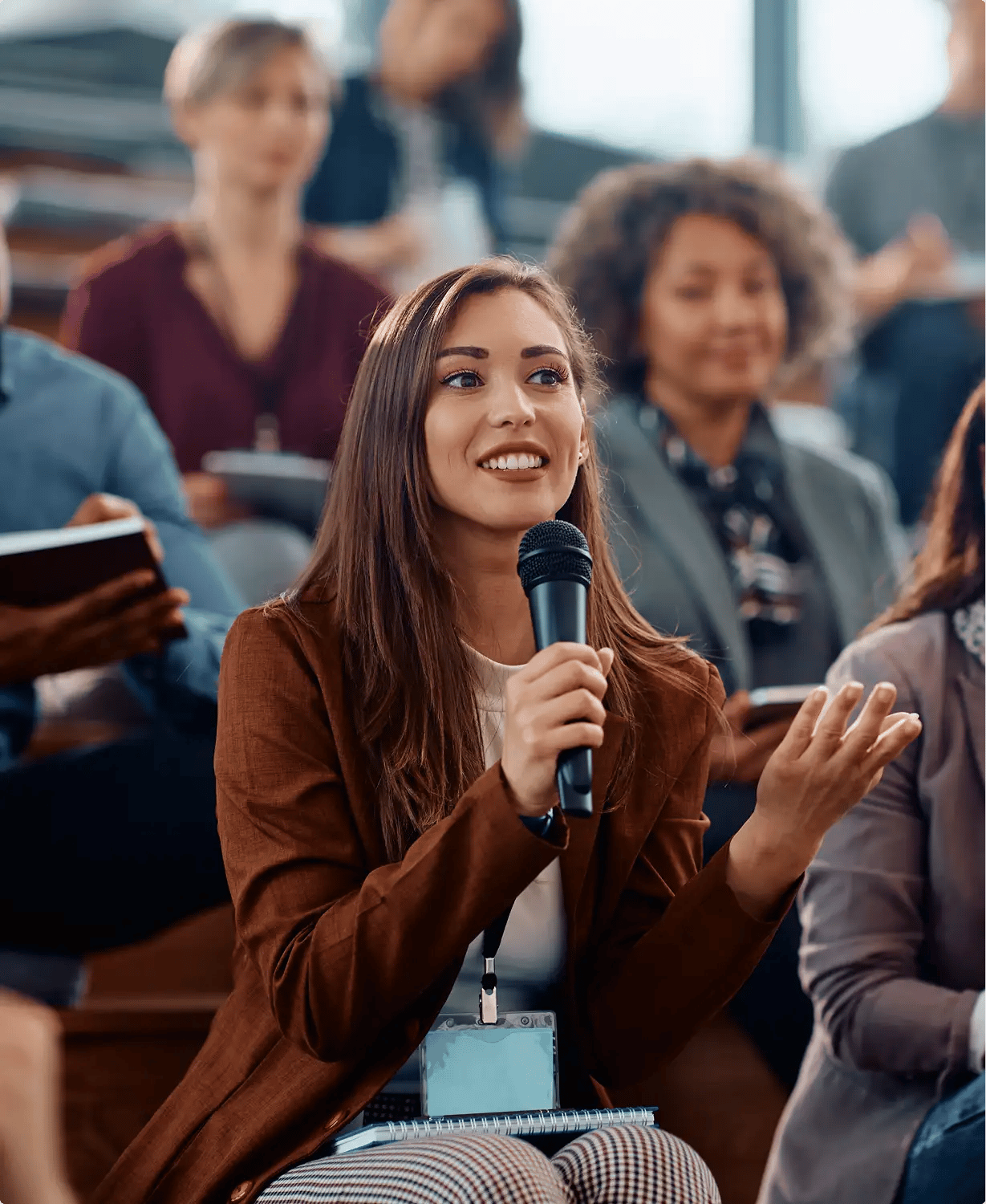 Young woman speaking with microphone